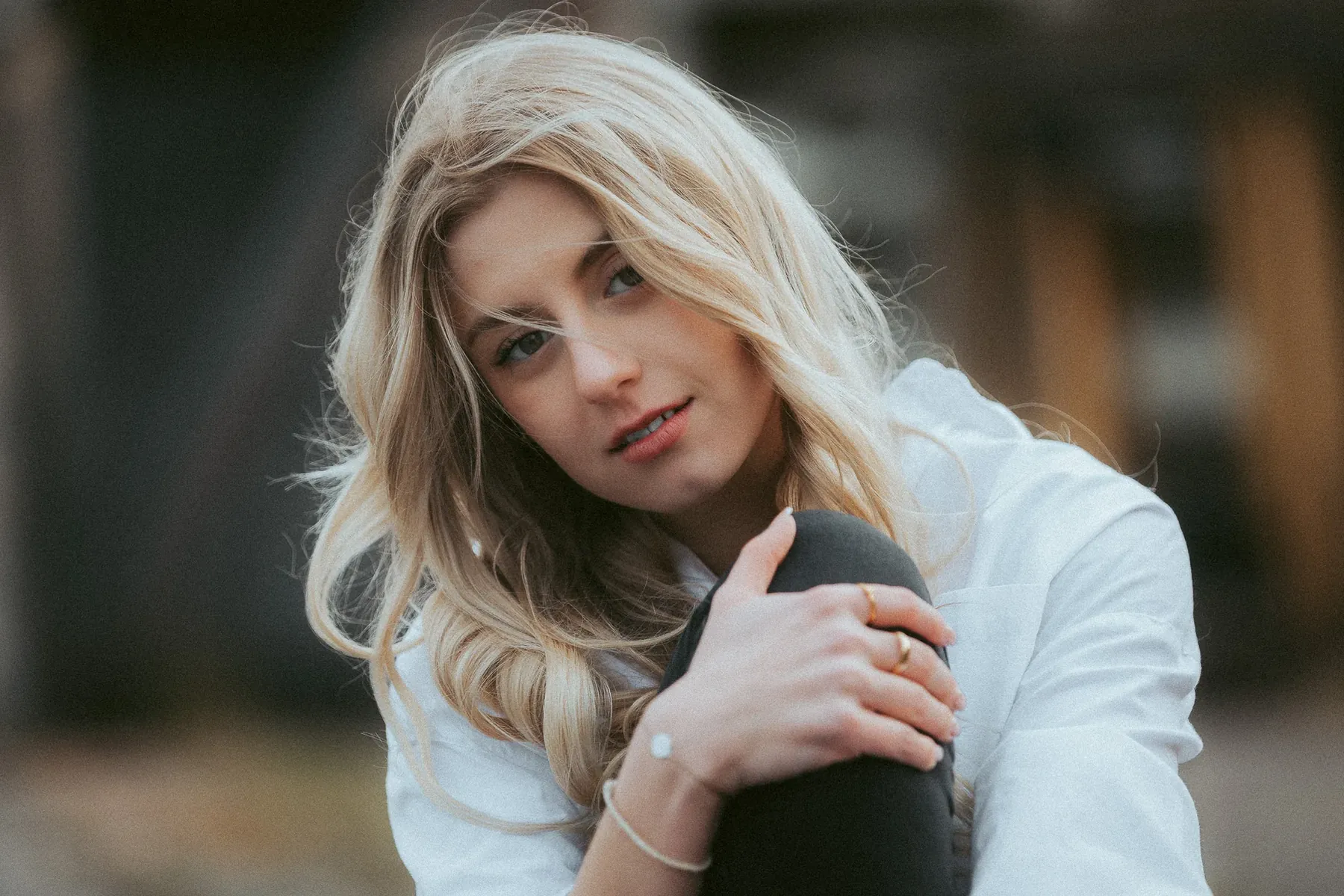Portrait of a blonde woman in a white jumper